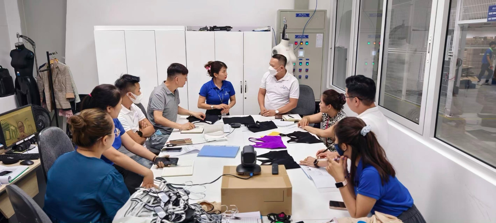 Sample review & fit meeting — tech, sales & production